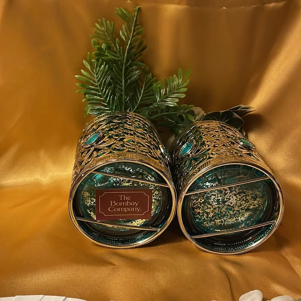 The Bombay Company metal over pair of teal glass w/teal jewels & fake greenery